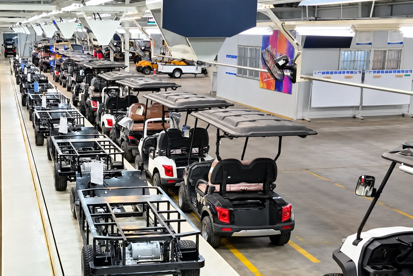 Electric vehicle assembly line with chassis and carts